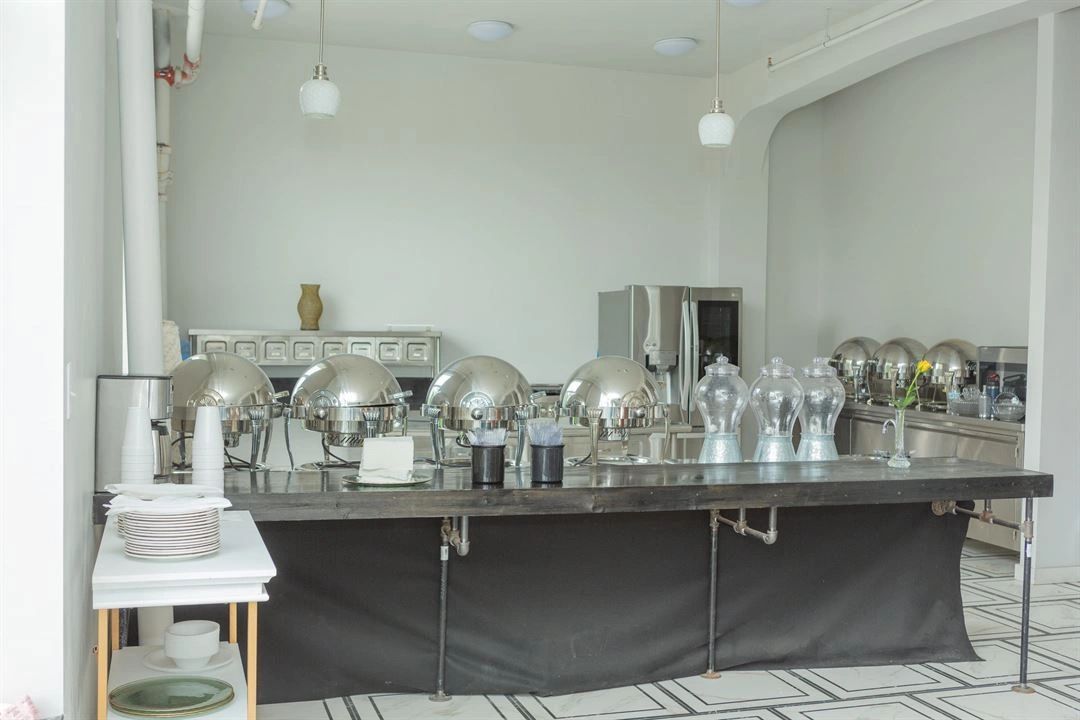 The prep kitchen set with chafing dishes for a buffet