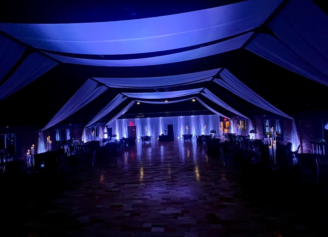 The Cadillac Showroom with blue lighting and a draped ceiling